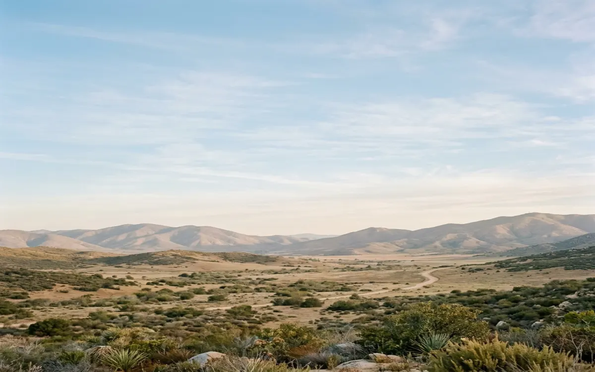 Calm East County valley ringed by soft mountains near El Cajon under wide, gentle morning light with open sky