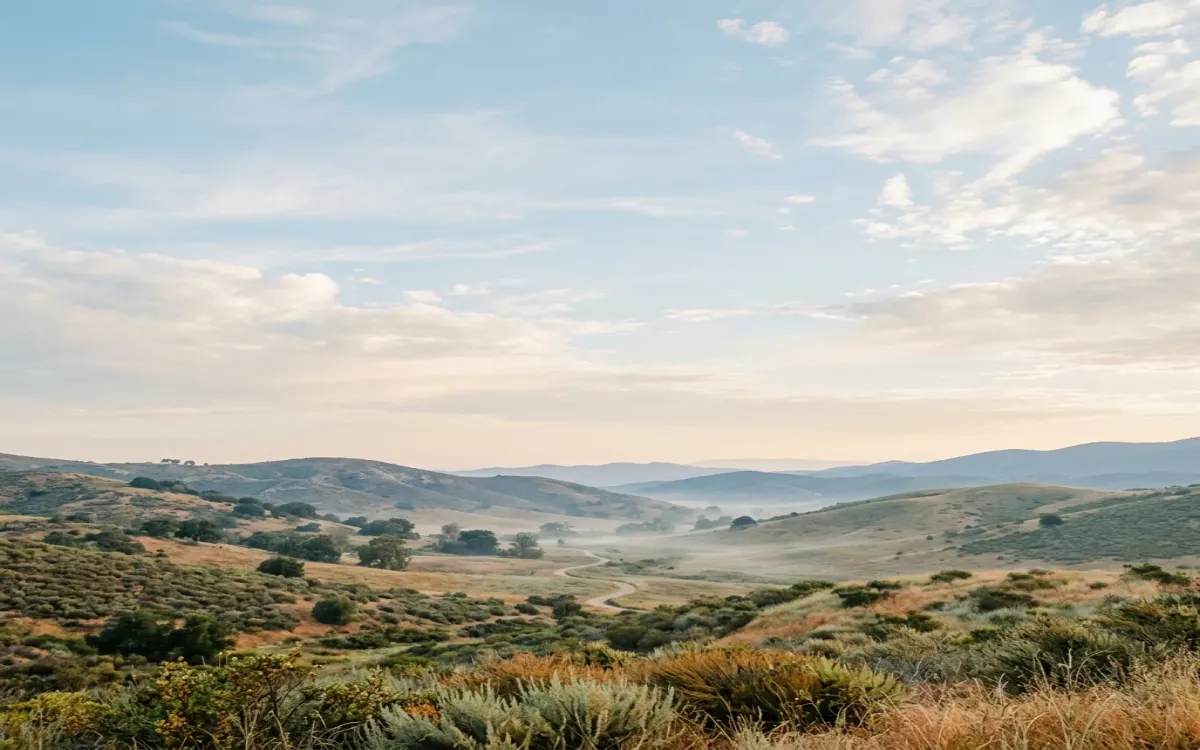 Calm inland North County valley and rolling hills near Escondido under soft morning light with wide open sky