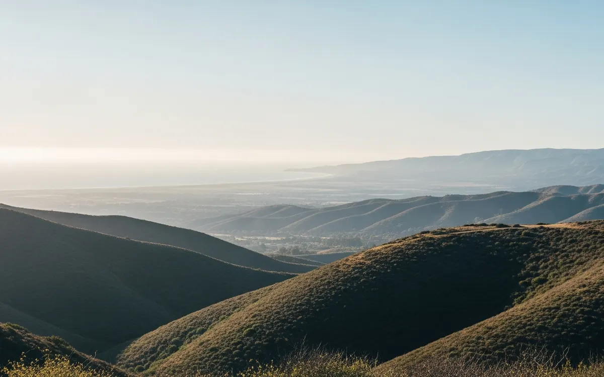 Calm Southern California hillside and open sky over a wide valley in soft morning light