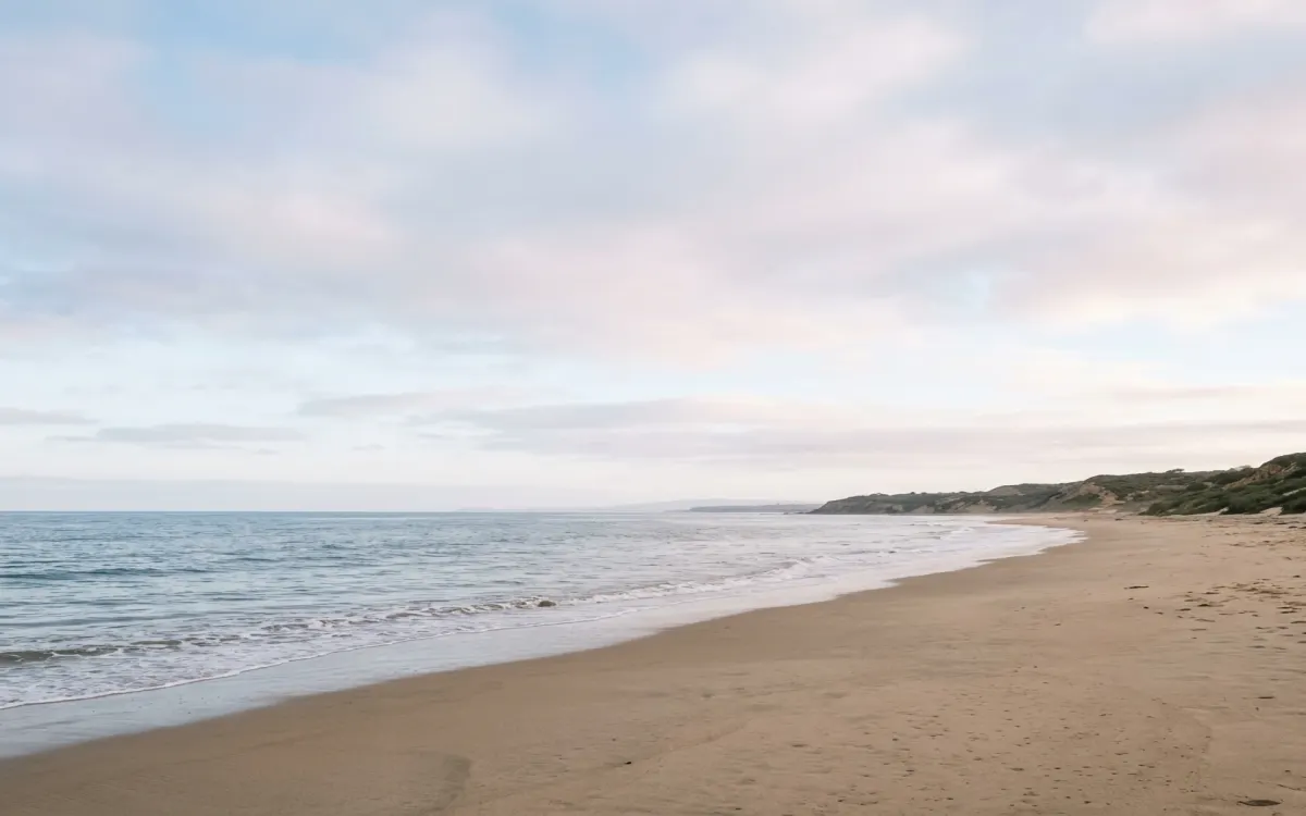 Calm North County San Diego coastline and open shore near Oceanside under soft morning light with wide sky