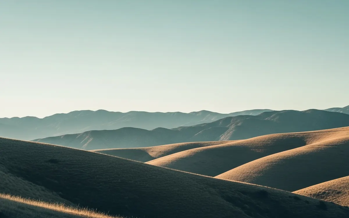 Calm Pomona Valley foothills and open sky in soft morning light with rolling hills