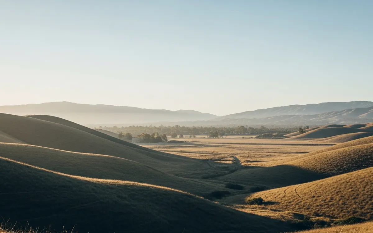 Calm inland North County San Diego hills and open valley under soft morning light with wide sky